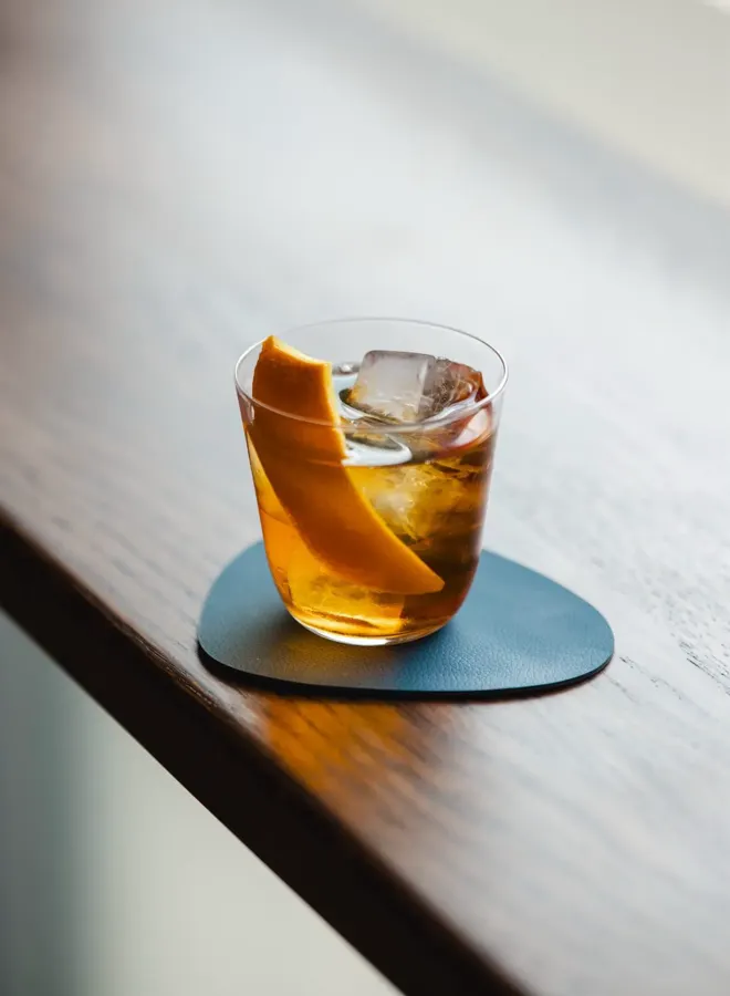 Old Fashioned cocktail sitting on bar at Mode